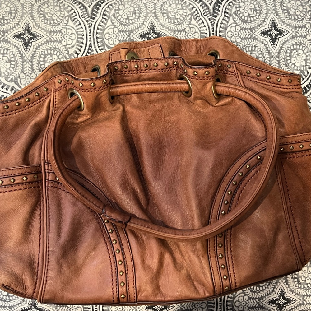 Brown soft leather Cole Haan hand bag with rivets great used condition